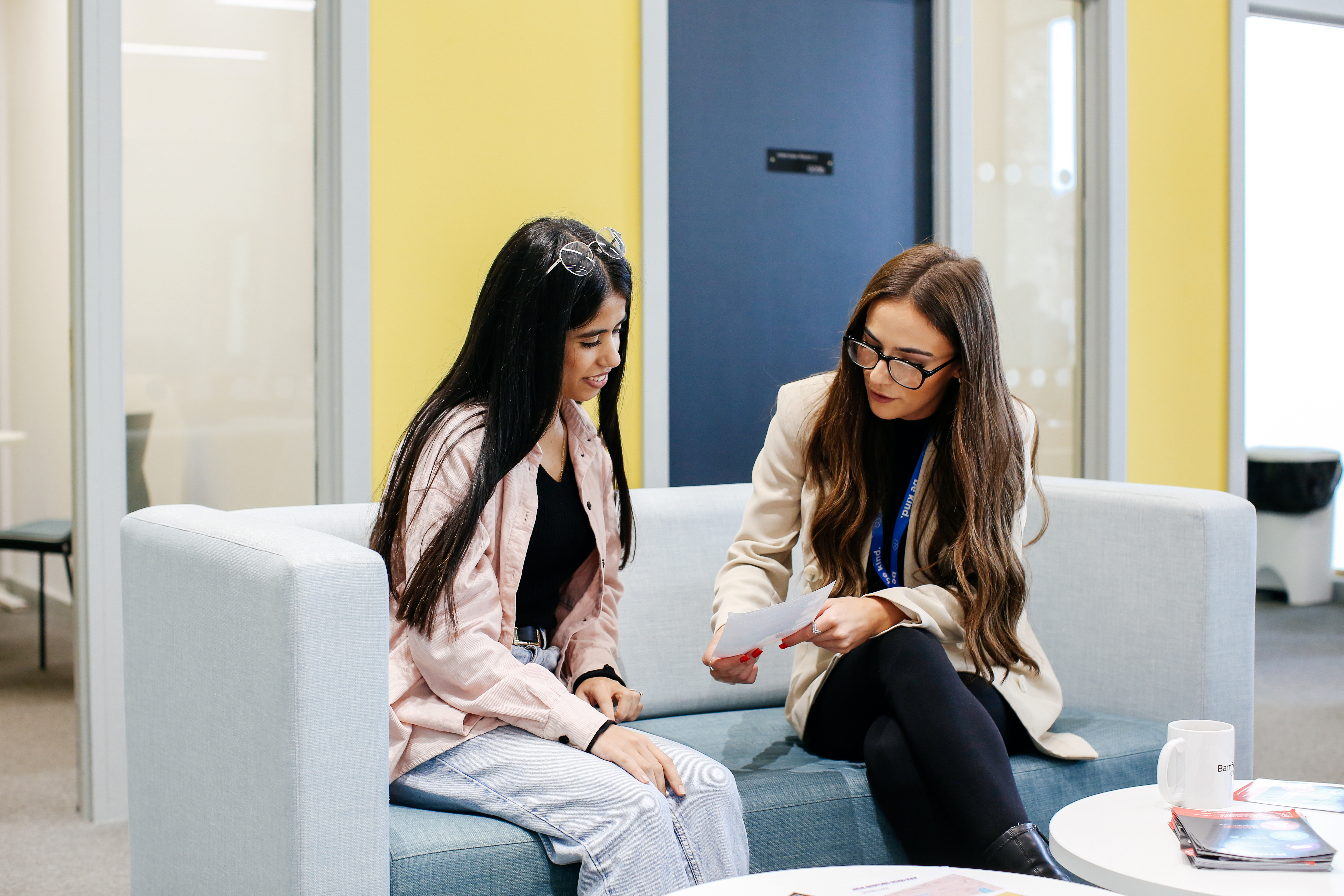 student and tutor looking at work