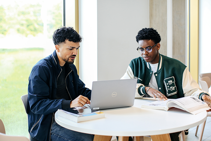 students looking at a laptop