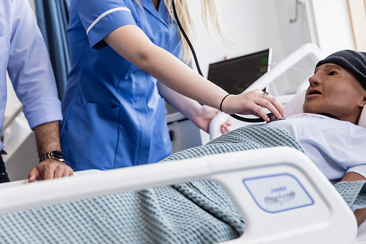 students taking vitals in ward