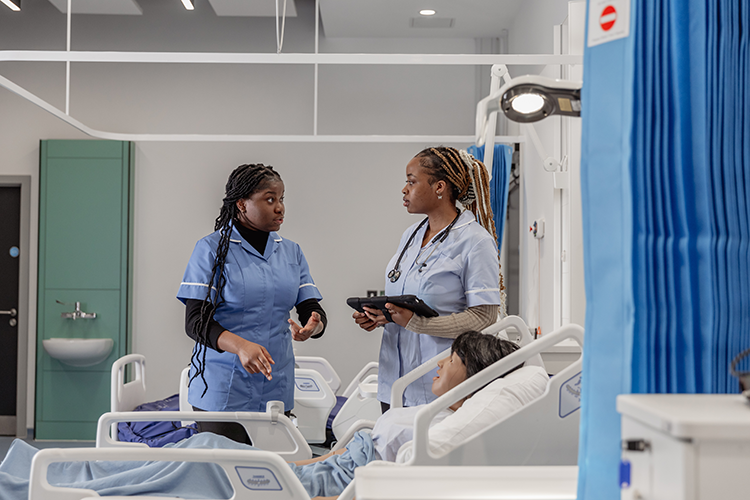 students talking in ward