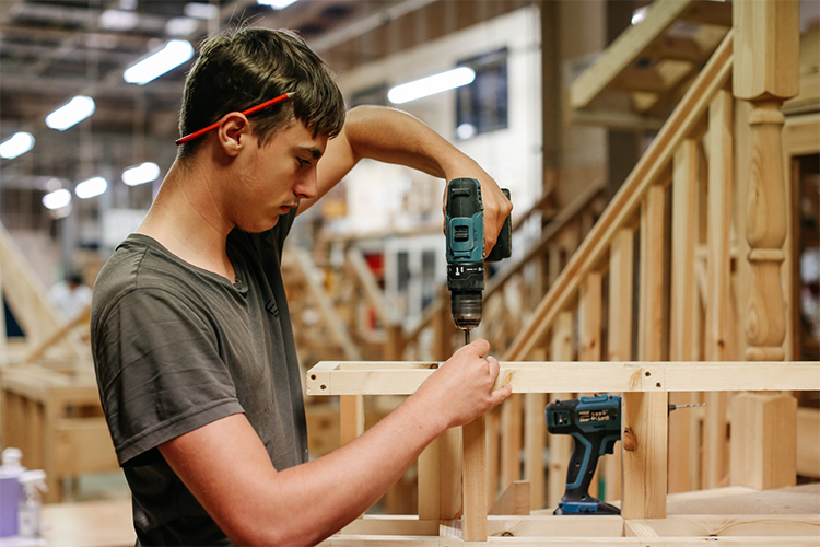 Student using a drill