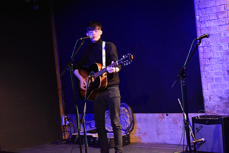 student playing guitar
