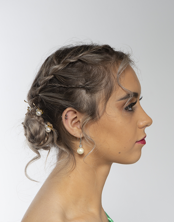Student facing side-on with glam makeup on
