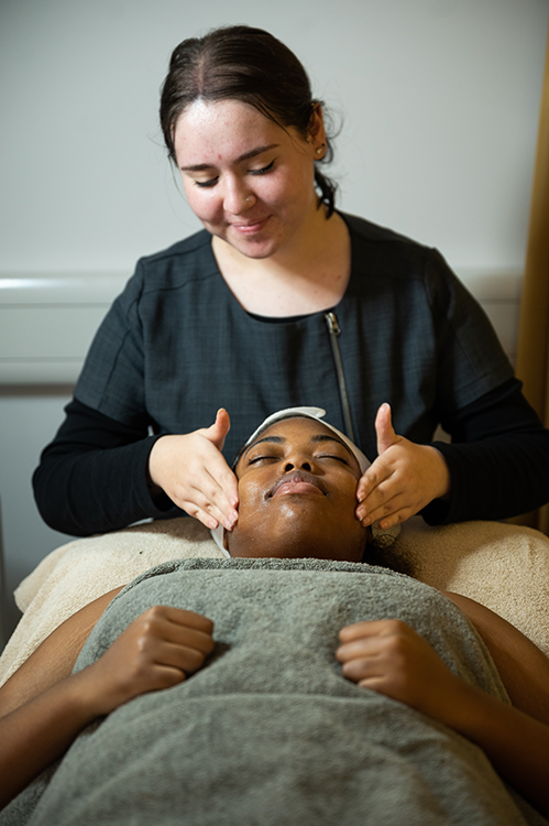 Student giving a facial