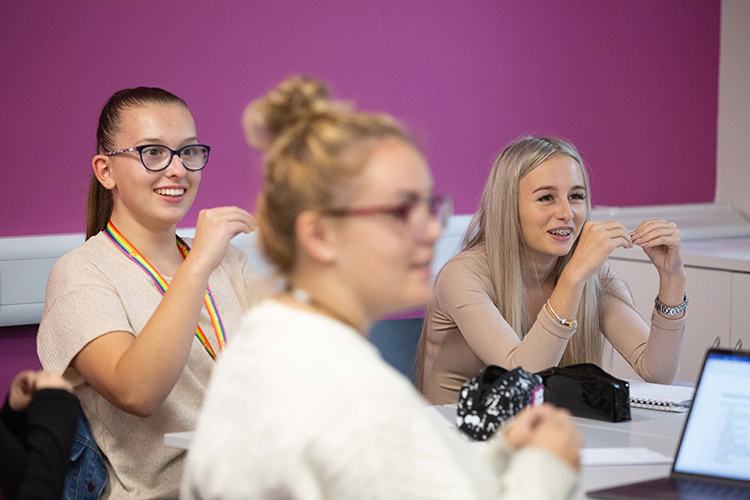 Students demonstrating sign language