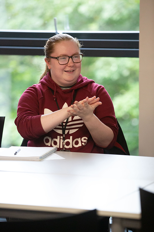 Student demonstrating sign language