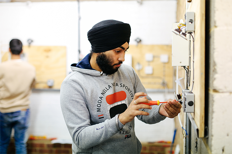Student Inspecting Wire