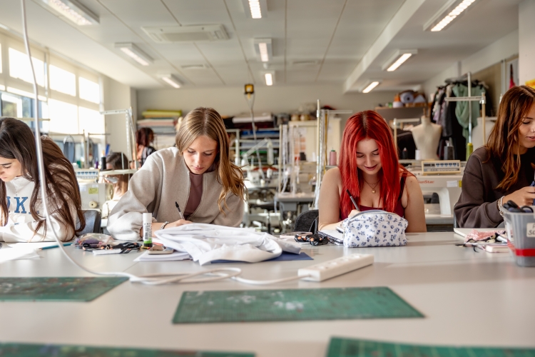 Students working on a fashion project