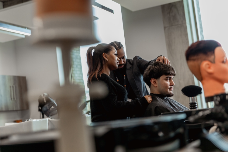 Student working on a barbering project