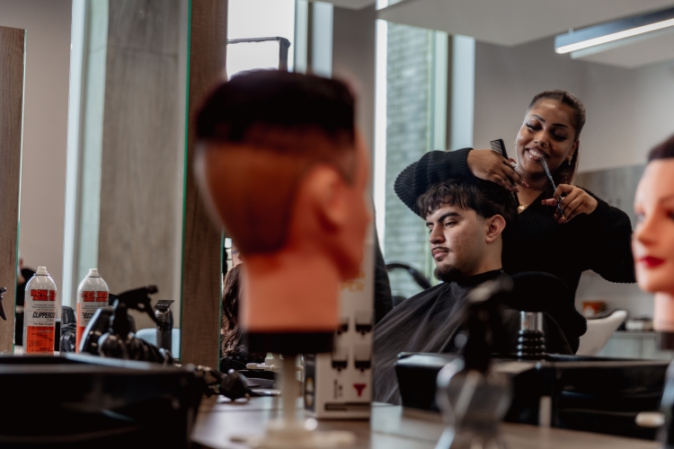 Student working on a barbering project