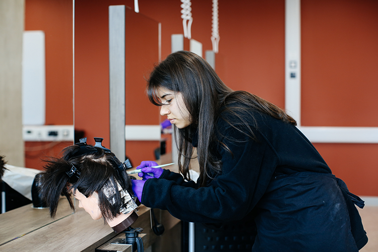 Student colouring hair