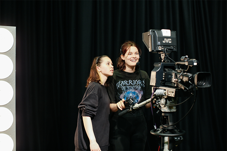 Students using a filming camera