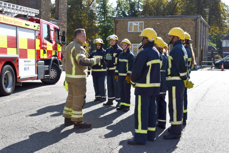 Fireman talking to group of students