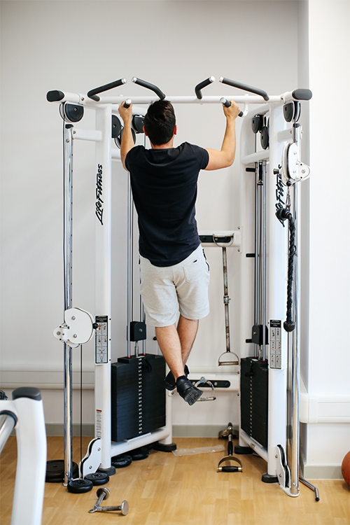 Student doing pull-up's in the gym