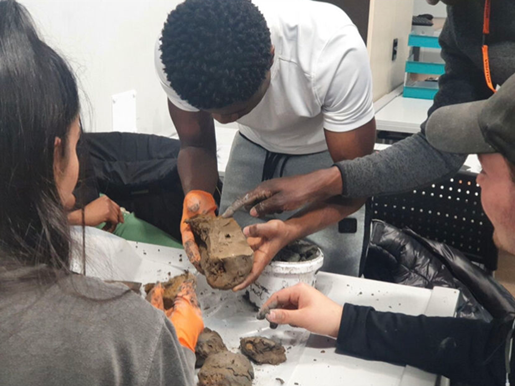 Students handling soil samples