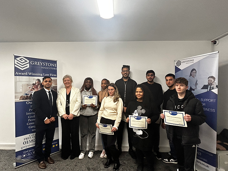 students holding certificates