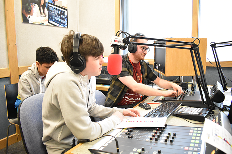 student presenting radio