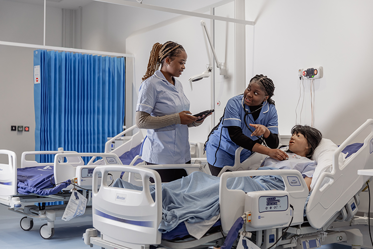 students taking vitals in ward