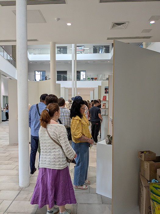 Visitors looking at student work