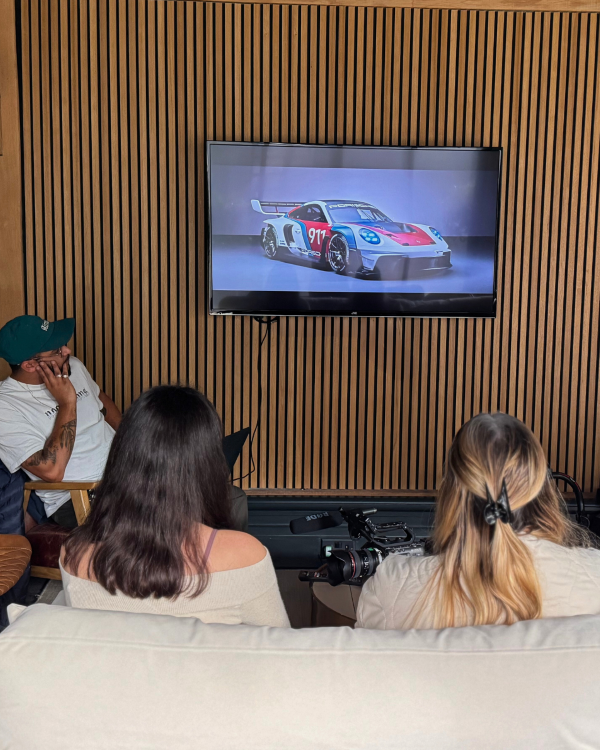 Students looking at a car on the TV