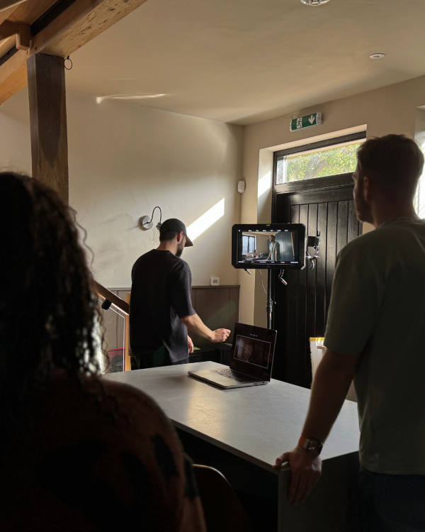 Behind a camera recording