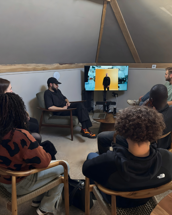 Students watching a video on a TV