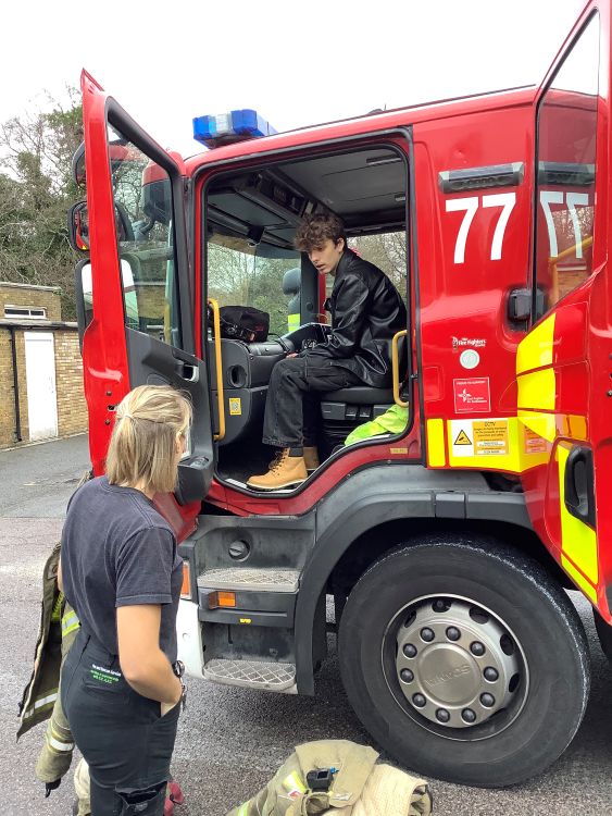 student sat in fire engine