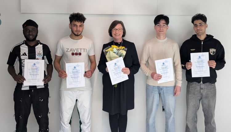 ESOL Students Holding Certificates