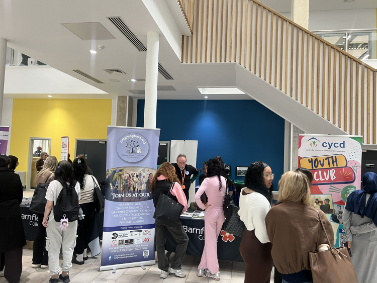 Students talking to exhibitors at Volunteers Fair
